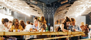 image of young people sitting at table with nice lighting in the evening